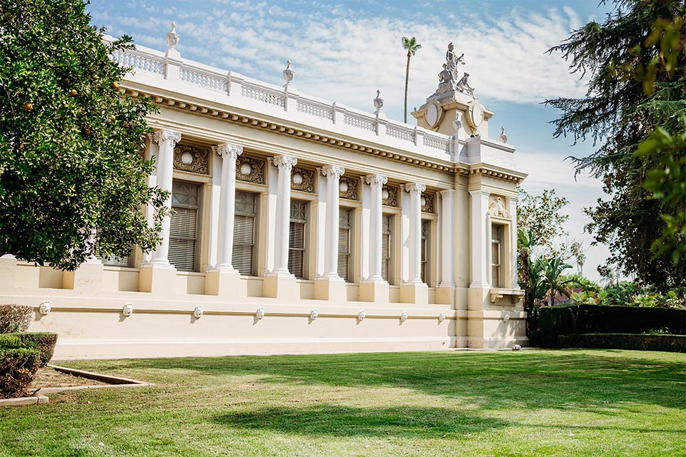 white courthouse building and lawn